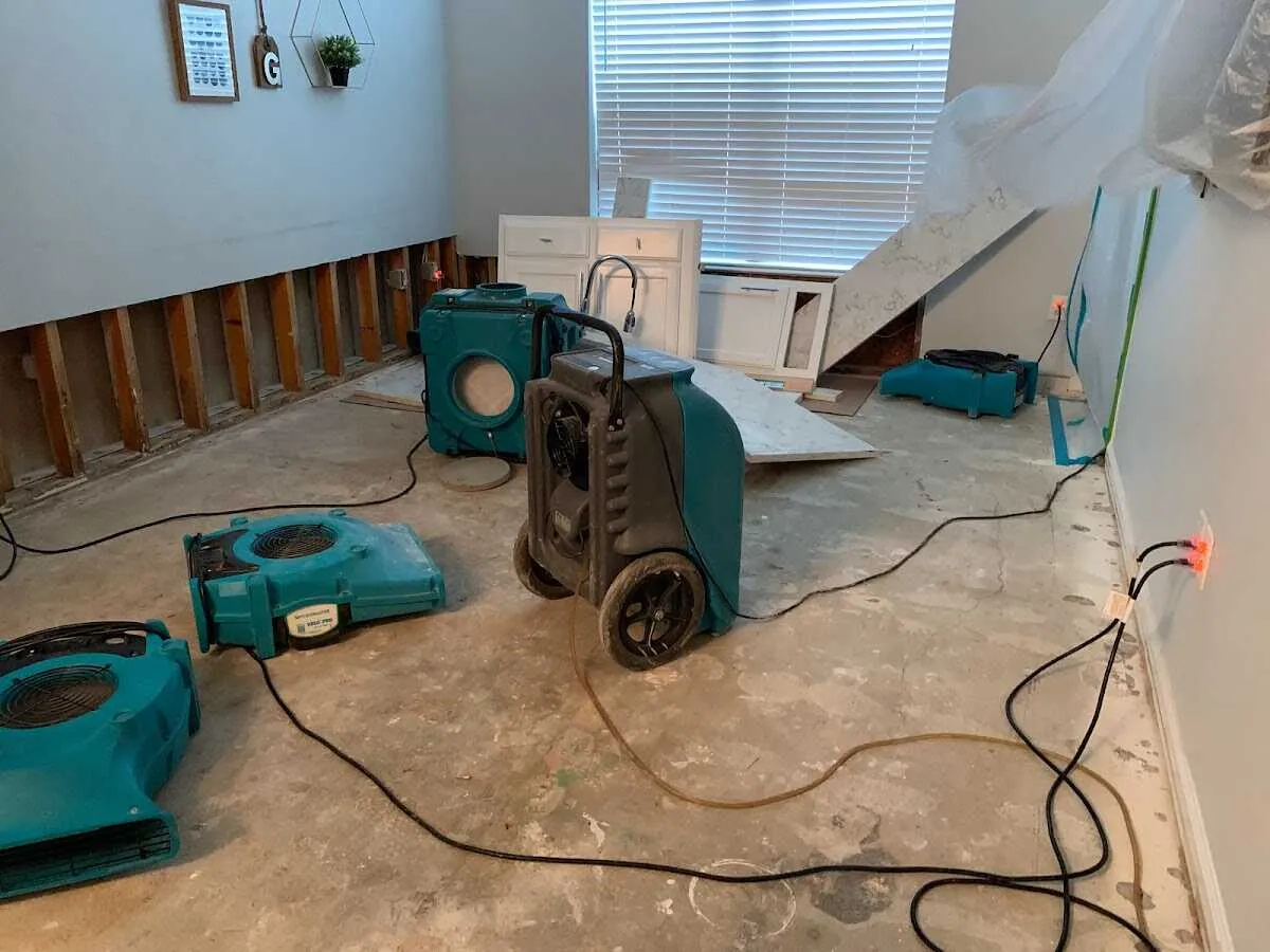 Dehumidifier in flood-cut room for Water Damage Restoration in Linton